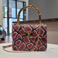 ARTISAN ITALIAN LEATHER SNAKE PRINT HANDBAG WITH BAMBOO HANDLE AND CHAIN